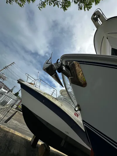  Yacht Photos Pics 2013 Contender 30 ST boats docked under a cloudy sky.