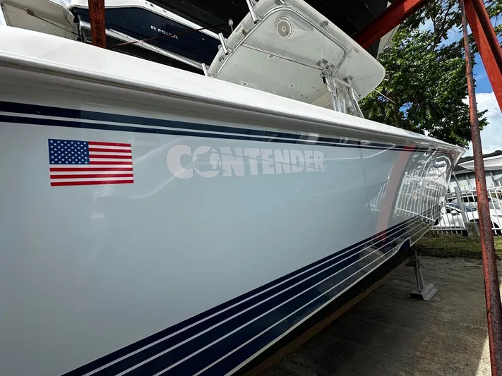  Yacht Photos Pics 2013 Contender 30 ST boat with American flag decal, side view.
