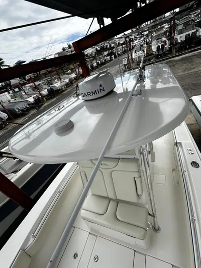  Yacht Photos Pics 2013 Contender 30 ST boat with Garmin equipment, docked in a marina.