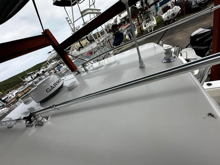  Yacht Photos Pics 2013 Contender 30 ST boat with Garmin equipment, docked in a marina.