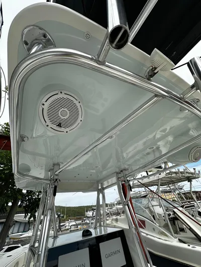  Yacht Photos Pics 2013 Contender 30 ST boat with T-top and Garmin electronics at a marina.