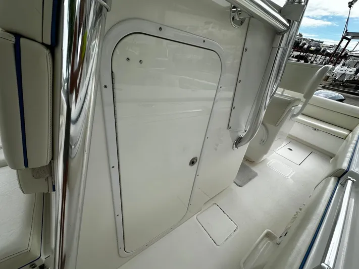  Yacht Photos Pics 2013 Contender 30 ST boat interior with storage compartment and seating.