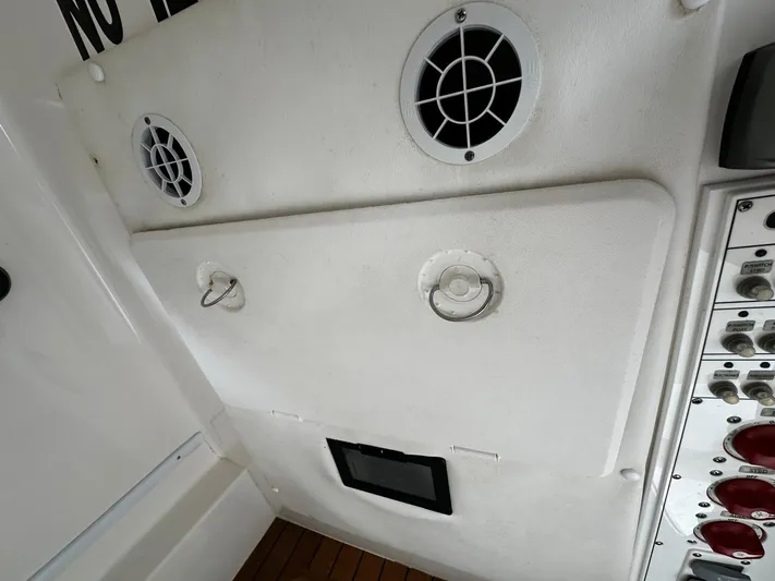  Yacht Photos Pics 2013 Contender 30 ST boat interior with speakers and control panel.