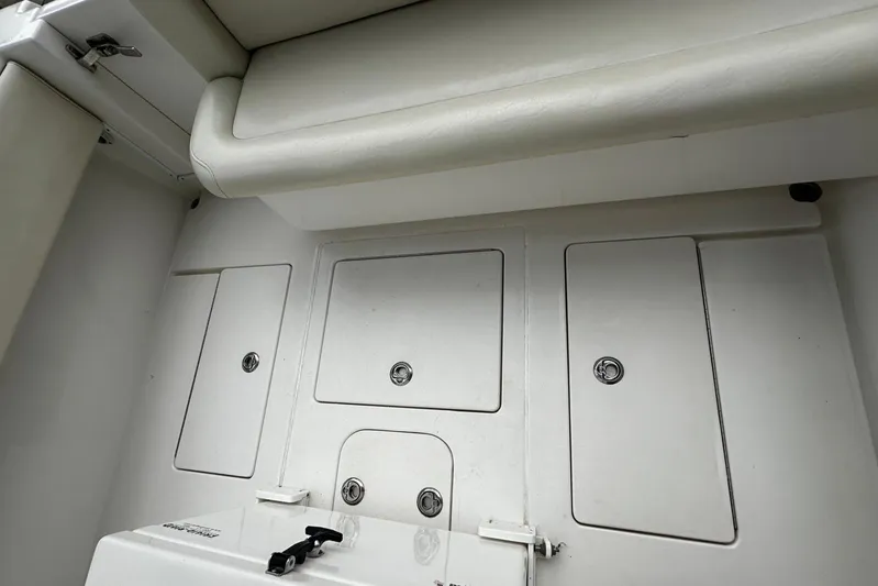  Yacht Photos Pics 2013 Contender 30 ST boat storage compartments with cushioned seating.