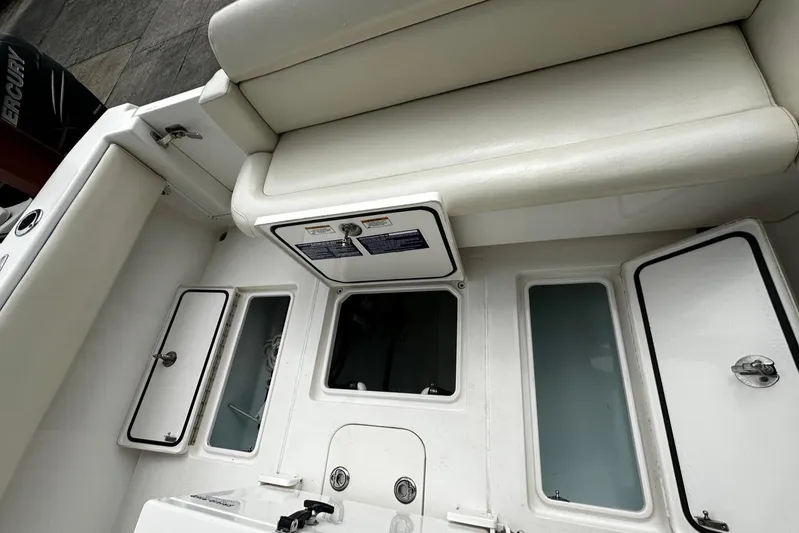  Yacht Photos Pics 2013 Contender 30 ST boat interior with storage compartments and seating.