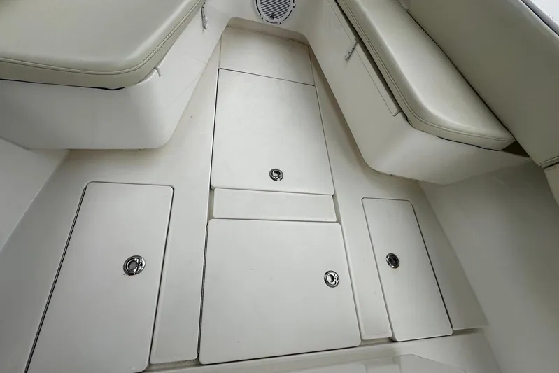  Yacht Photos Pics 2013 Contender 30 ST boat interior with storage compartments and cushioned seating.
