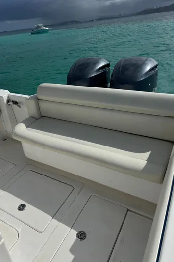  Yacht Photos Pics 2013 Contender 30 ST boat with dual engines, white seating, and turquoise water backdrop.