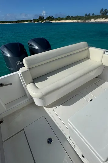  Yacht Photos Pics 2013 Contender 30 ST boat with dual engines, white seating, and scenic ocean view.