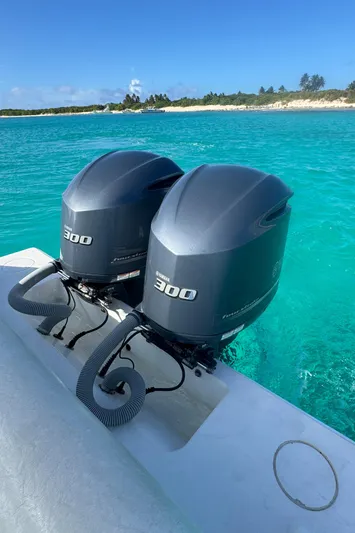  Yacht Photos Pics 2013 Contender 30 ST boat with twin Yamaha 300 engines on turquoise water.