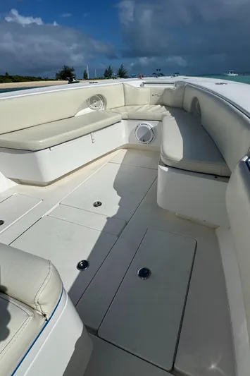  Yacht Photos Pics 2013 Contender 30 ST boat interior with white seating and storage compartments.