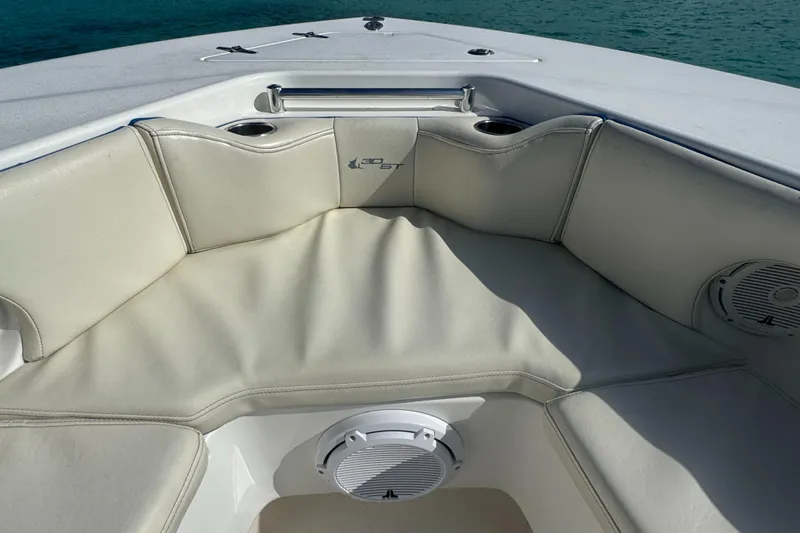  Yacht Photos Pics 2013 Contender 30 ST boat interior with cushioned seating and cup holders.