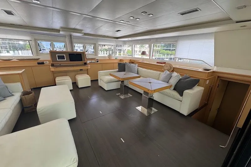 London Sky Yacht Photos Pics Luxurious interior of 2015 Lagoon Motor Yacht with modern seating and large windows.