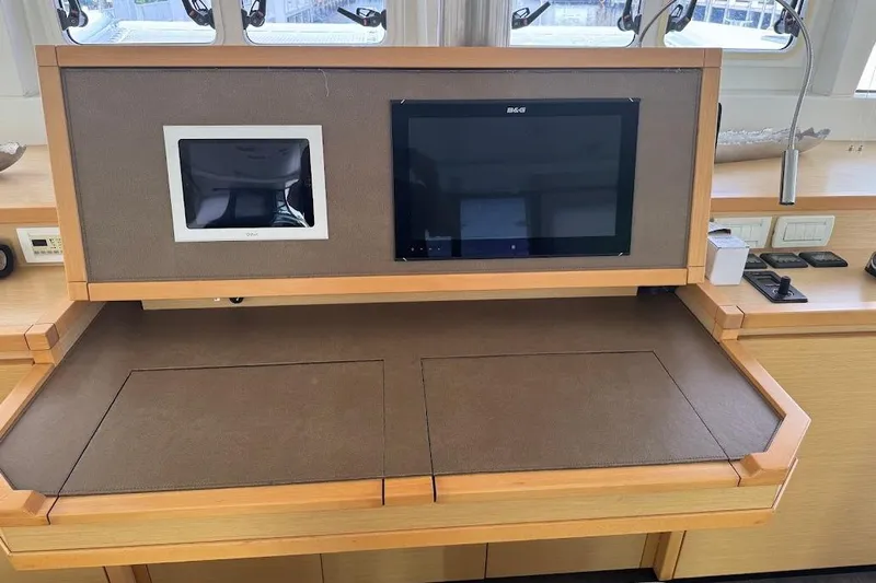 London Sky Yacht Photos Pics Control panel of a 2015 Lagoon Motor Yacht with navigation screens.