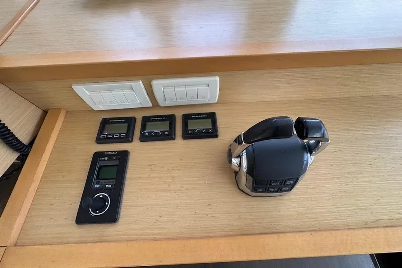 London Sky Yacht Photos Pics Control panel of a 2015 Lagoon Motor Yacht with switches and throttle.