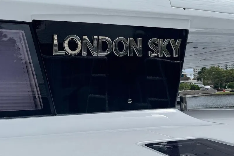 London Sky Yacht Photos Pics Lagoon Motor Yacht 2015 with "London Sky" nameplate, docked near water.