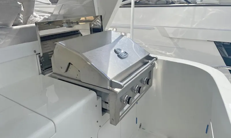 Our Way III Yacht Photos Pics Outdoor stainless steel grill on 2023 Outer Reef Yachts 720 Motoryacht deck.