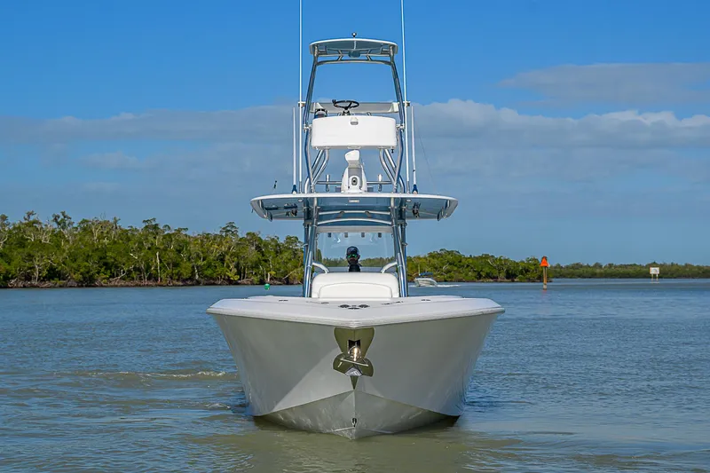 Mare Yacht Photos Pics Front view of a 2019 Bahama 41 boat on calm water, clear sky background.