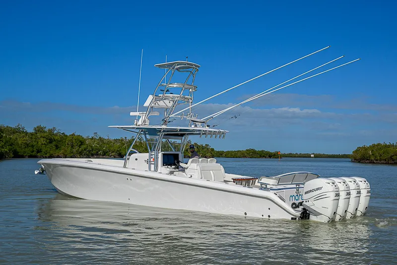 Mare Yacht Photos Pics 2019 Bahama 41 boat with multiple outboard engines on calm water.