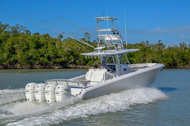 Mare Yacht Photos Pics 2019 Bahama 41 boat cruising on water with four powerful engines.