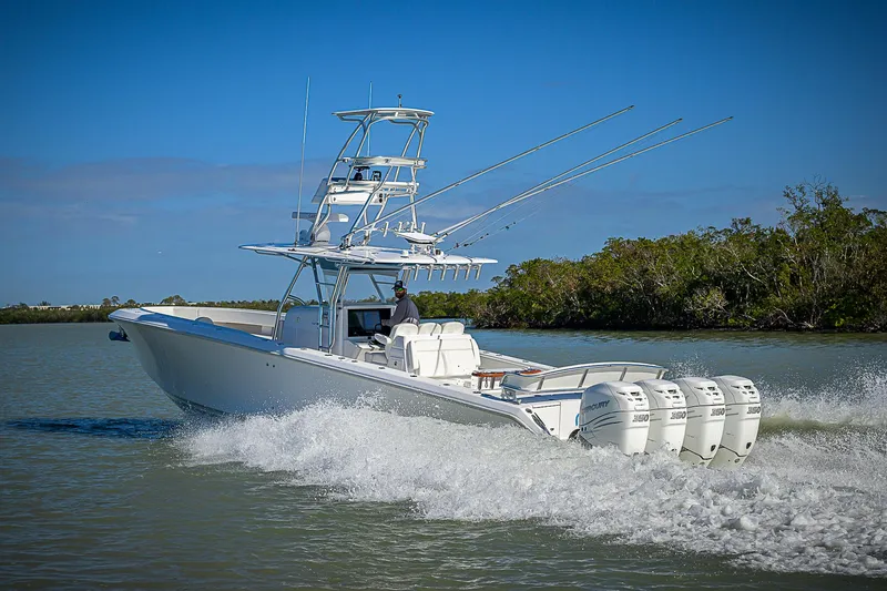 Mare Yacht Photos Pics 2019 Bahama 41 boat cruising on water with multiple outboard engines.