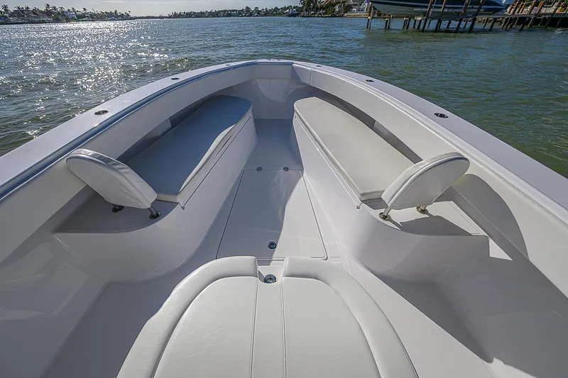 Mare Yacht Photos Pics 2019 Bahama 41 boat interior with seating, on calm water.