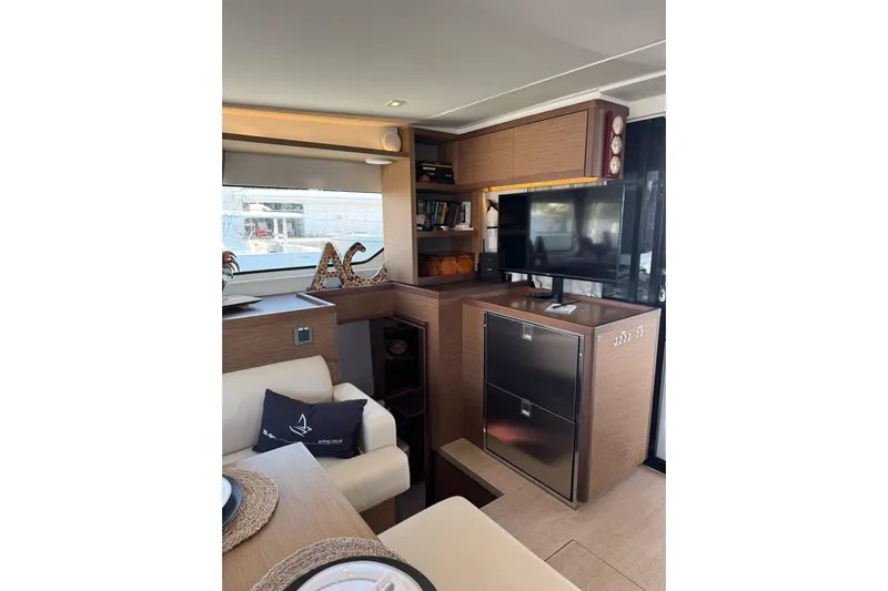  Yacht Photos Pics Interior of 2020 Lagoon 46 yacht with modern furnishings and entertainment setup.