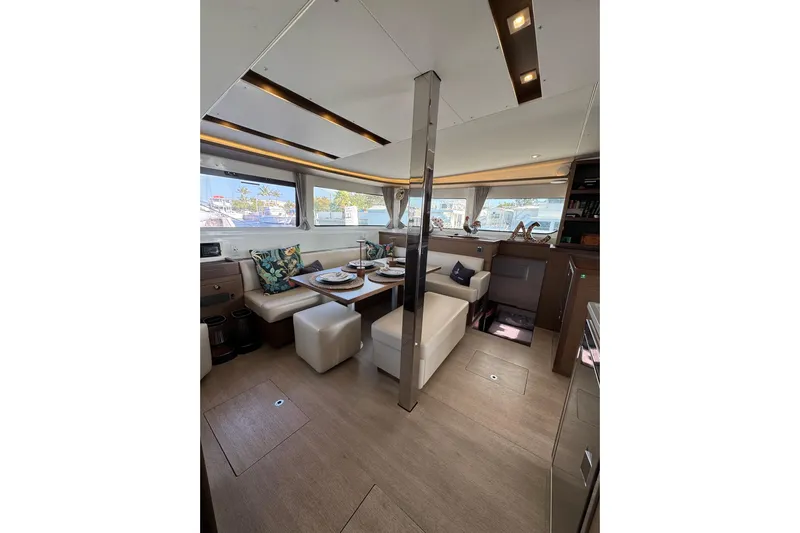 Yacht Photos Pics Luxurious interior of 2020 Lagoon 46 yacht with elegant dining area and modern decor.