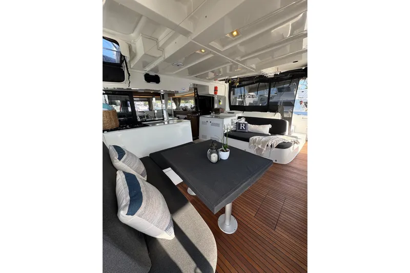  Yacht Photos Pics Luxurious interior of 2020 Lagoon 46 yacht with modern seating and dining area.