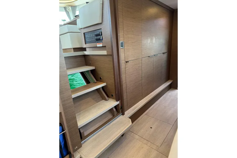  Yacht Photos Pics Interior of 2020 Lagoon 46 yacht featuring wooden stairs and modern paneling.