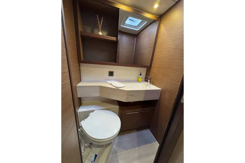  Yacht Photos Pics Modern bathroom in 2020 Lagoon 46 yacht with sleek design and wooden accents.