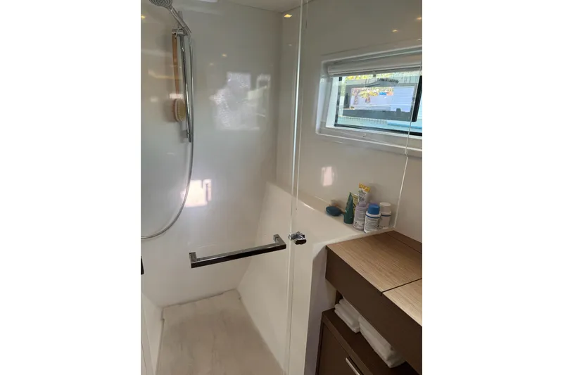  Yacht Photos Pics Modern bathroom in 2020 Lagoon 46 yacht with shower and storage.