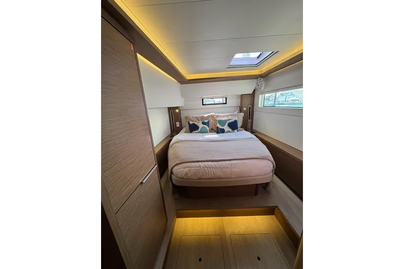  Yacht Photos Pics Luxurious cabin interior of 2020 Lagoon 46 yacht with modern design and ambient lighting.