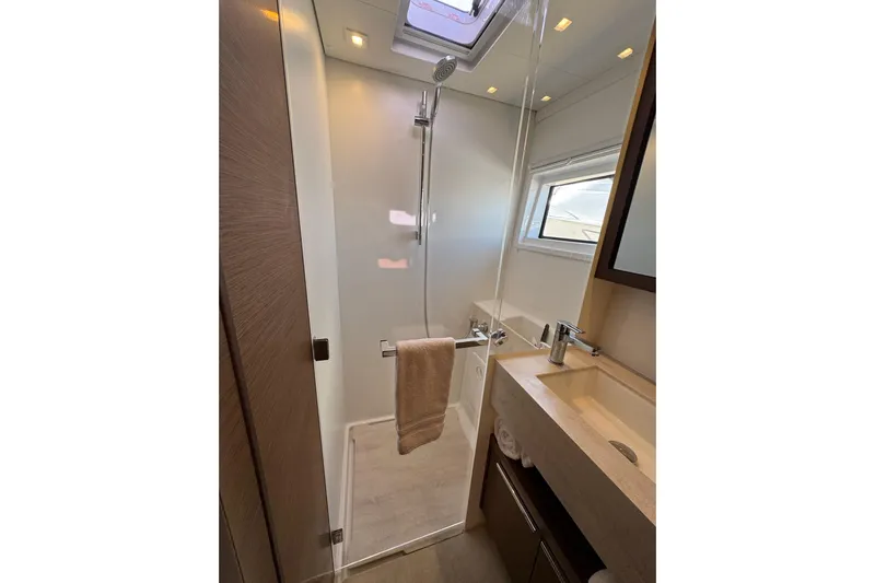  Yacht Photos Pics Modern bathroom in 2020 Lagoon 46 yacht with shower and sink.