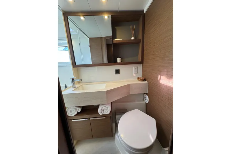  Yacht Photos Pics Modern bathroom in 2020 Lagoon 46 yacht with sleek fixtures and wooden accents.