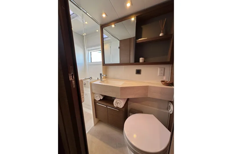  Yacht Photos Pics Luxurious bathroom in 2020 Lagoon 46 yacht with modern fixtures and elegant design.