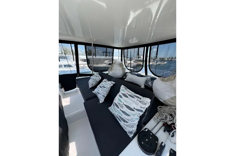  Yacht Photos Pics Luxurious interior of 2020 Lagoon 46 catamaran with plush seating and decorative pillows.