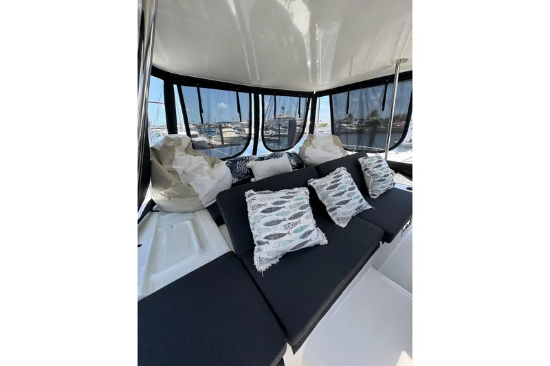  Yacht Photos Pics Interior of 2020 Lagoon 46 yacht with cozy seating and decorative pillows.