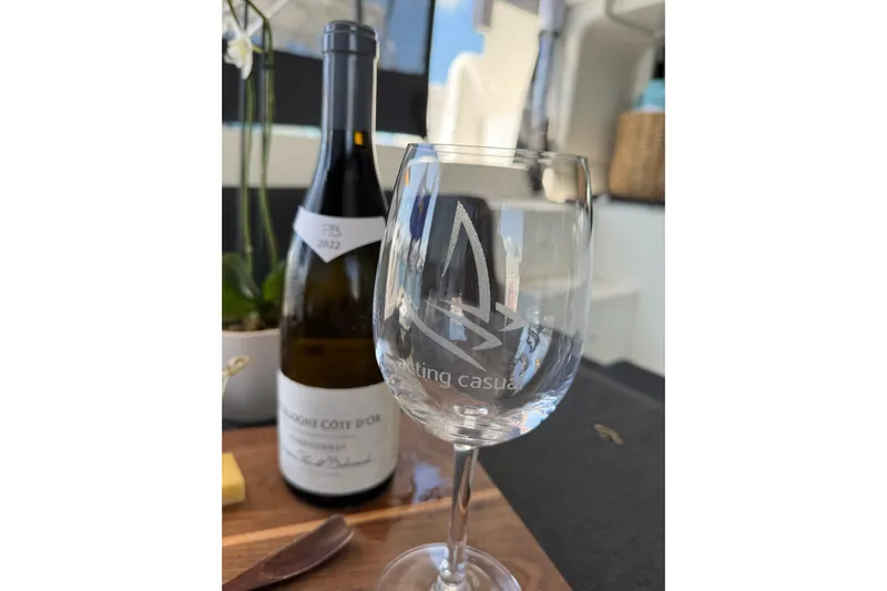  Yacht Photos Pics Wine glass and bottle on Lagoon 46 yacht, 2020 model, with elegant setting.