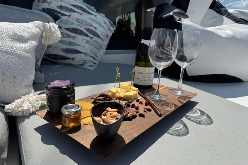  Yacht Photos Pics Luxurious charcuterie and wine setup on Lagoon 46 yacht, 2020 model.