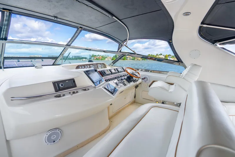 Knot Ez II Yacht Photos Pics Luxurious 1998 Sea Ray 450 Sundancer yacht interior with modern helm and panoramic views.
