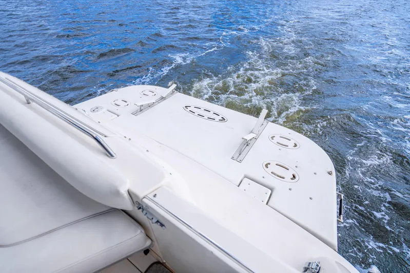 Knot Ez II Yacht Photos Pics 1998 Sea Ray 450 Sundancer boat on water, rear view with wake.