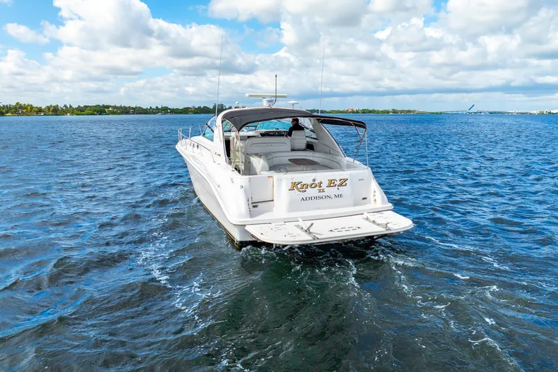 Knot Ez II Yacht Photos Pics 1998 Sea Ray 450 Sundancer yacht "Knot EZ" cruising on open water.