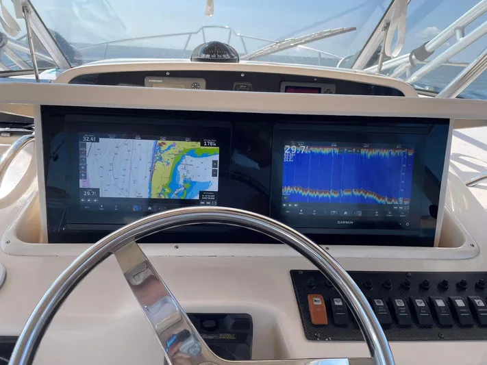  Yacht Photos Pics 2007 Grady-White Express 330 helm with dual Garmin displays and navigation controls.