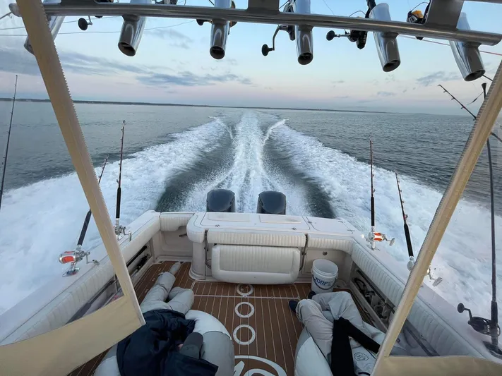  Yacht Photos Pics 2007 Grady-White Express 330 boat cruising on open water, fishing rods visible.