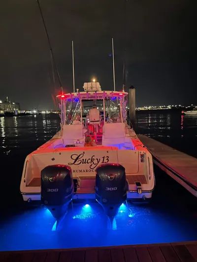  Yacht Photos Pics 2007 Grady-White Express 330 boat docked at night with illuminated blue lights.
