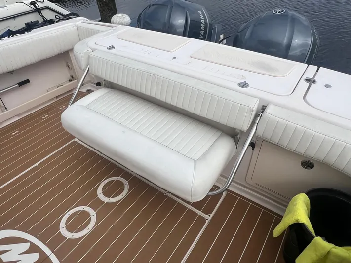  Yacht Photos Pics 2007 Grady-White Express 330 boat with foldable white bench seat and Yamaha engines.