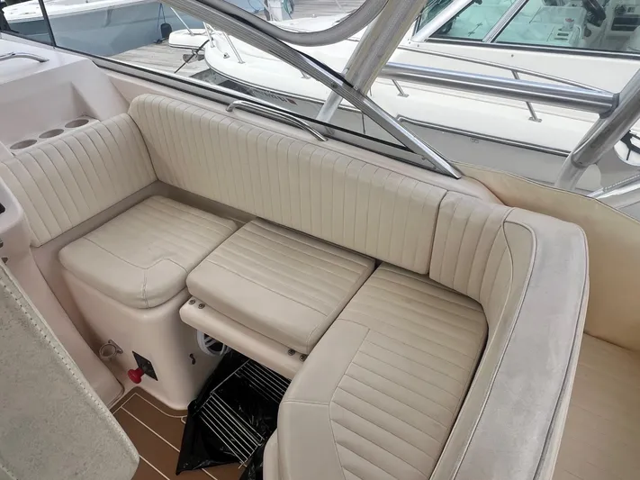  Yacht Photos Pics 2007 Grady-White Express 330 boat interior with beige seating and cup holders.