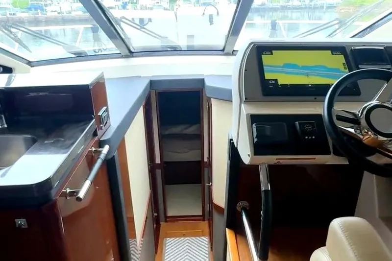 Caroline Kai Yacht Photos Pics Interior view of 2016 Sea Ray 510 Fly yacht cockpit with navigation system.