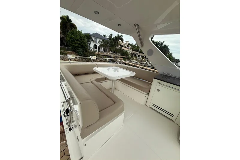 Caroline Kai Yacht Photos Pics Luxurious seating area on a 2016 Sea Ray 510 Fly yacht, featuring elegant design.