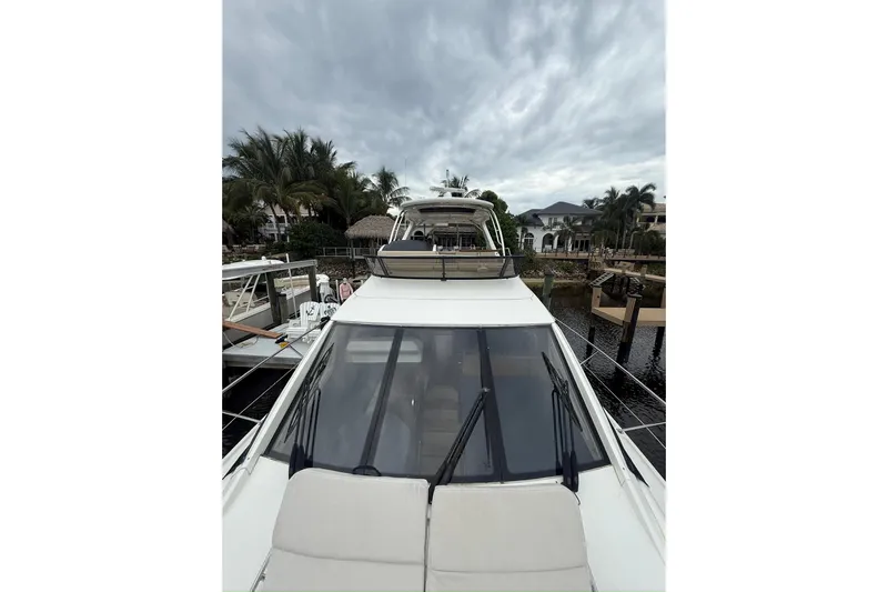 Caroline Kai Yacht Photos Pics 2016 Sea Ray 510 Fly yacht docked, featuring sleek design and spacious deck.